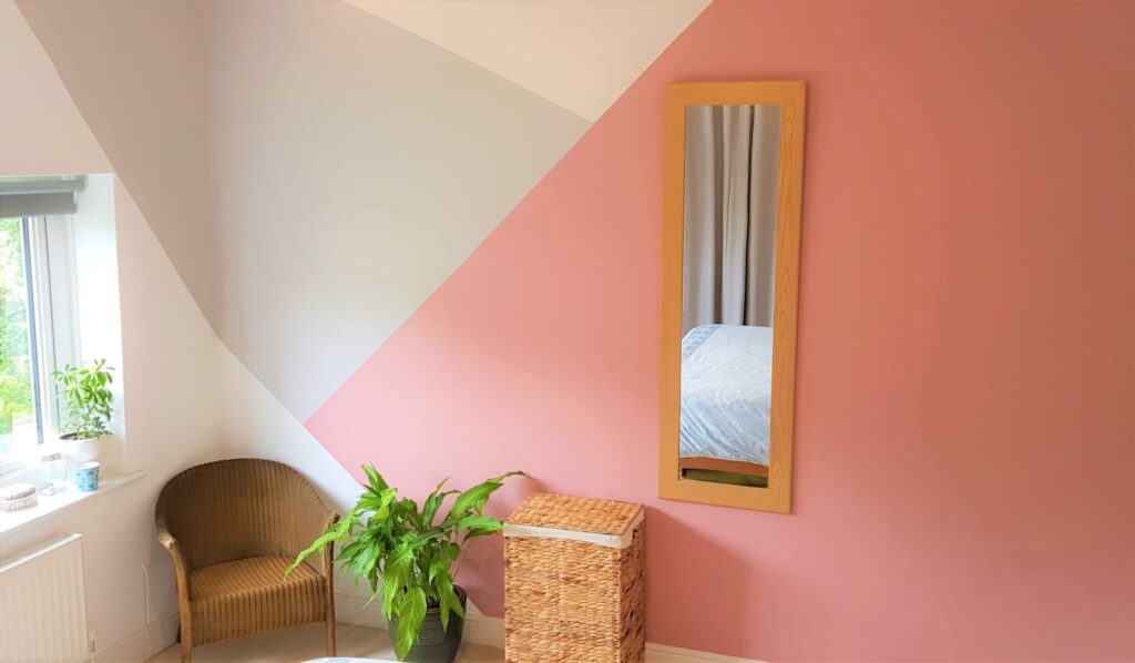 Bedroom with painted geometric pattern Cleaning walls after painting