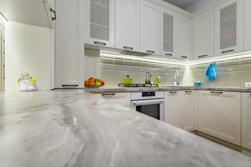 Small white cozy and comfy contemporary classic kitchen interior with wooden furniture,
Essential Cabinet Maintenance Tips