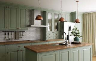 Sage green painted kitchen cabinetry with white subway tile backsplash, wood countertops, and copper pendant lights